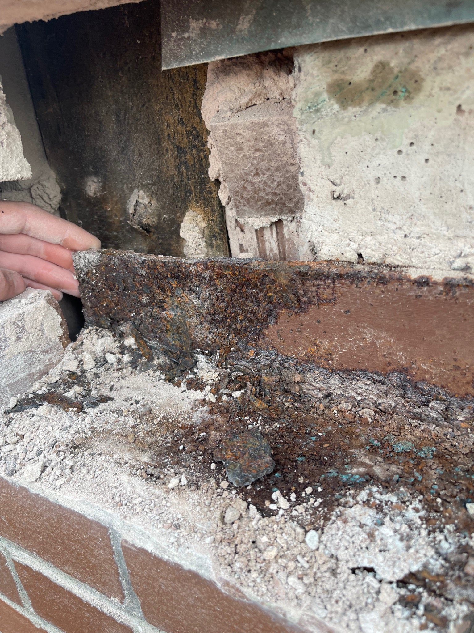 Brick opening at the J David Stewart Armoury opened for repair around a failed corroded lintel