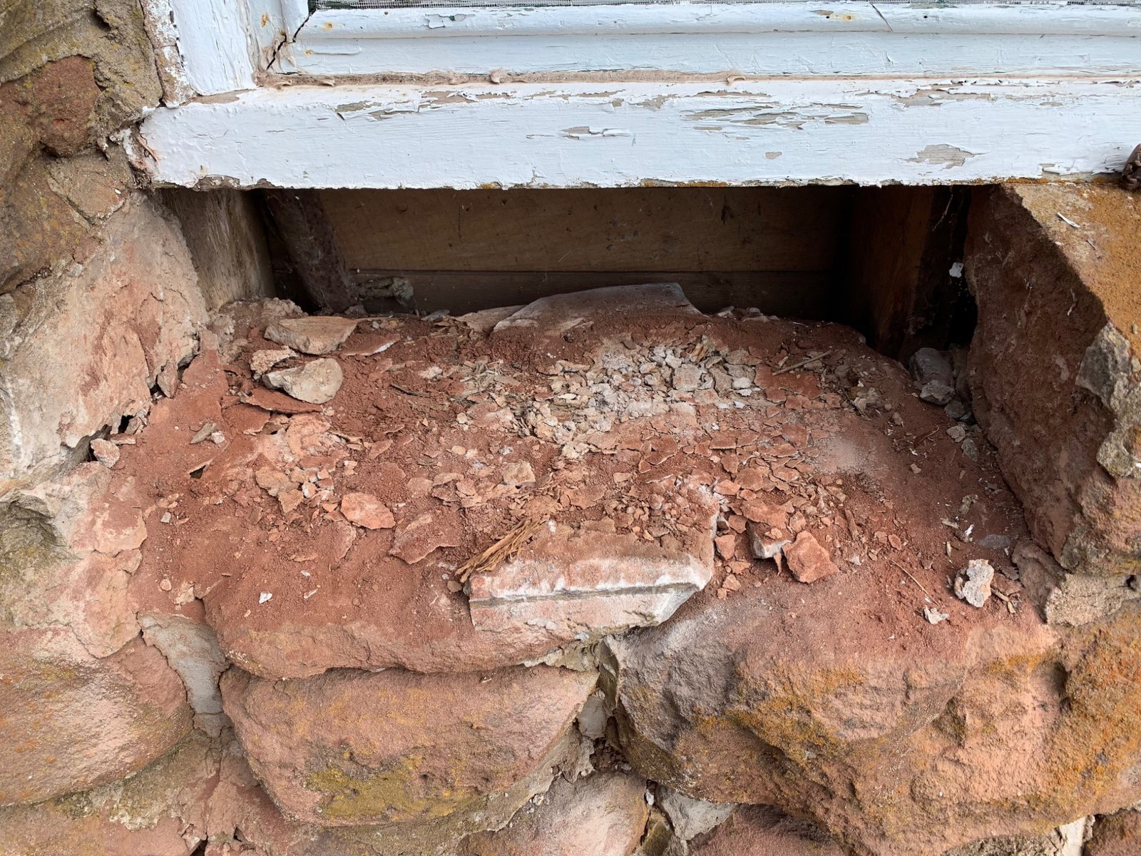 Historic sandstone window sill deterioration at Dalvay by the Sea before repair