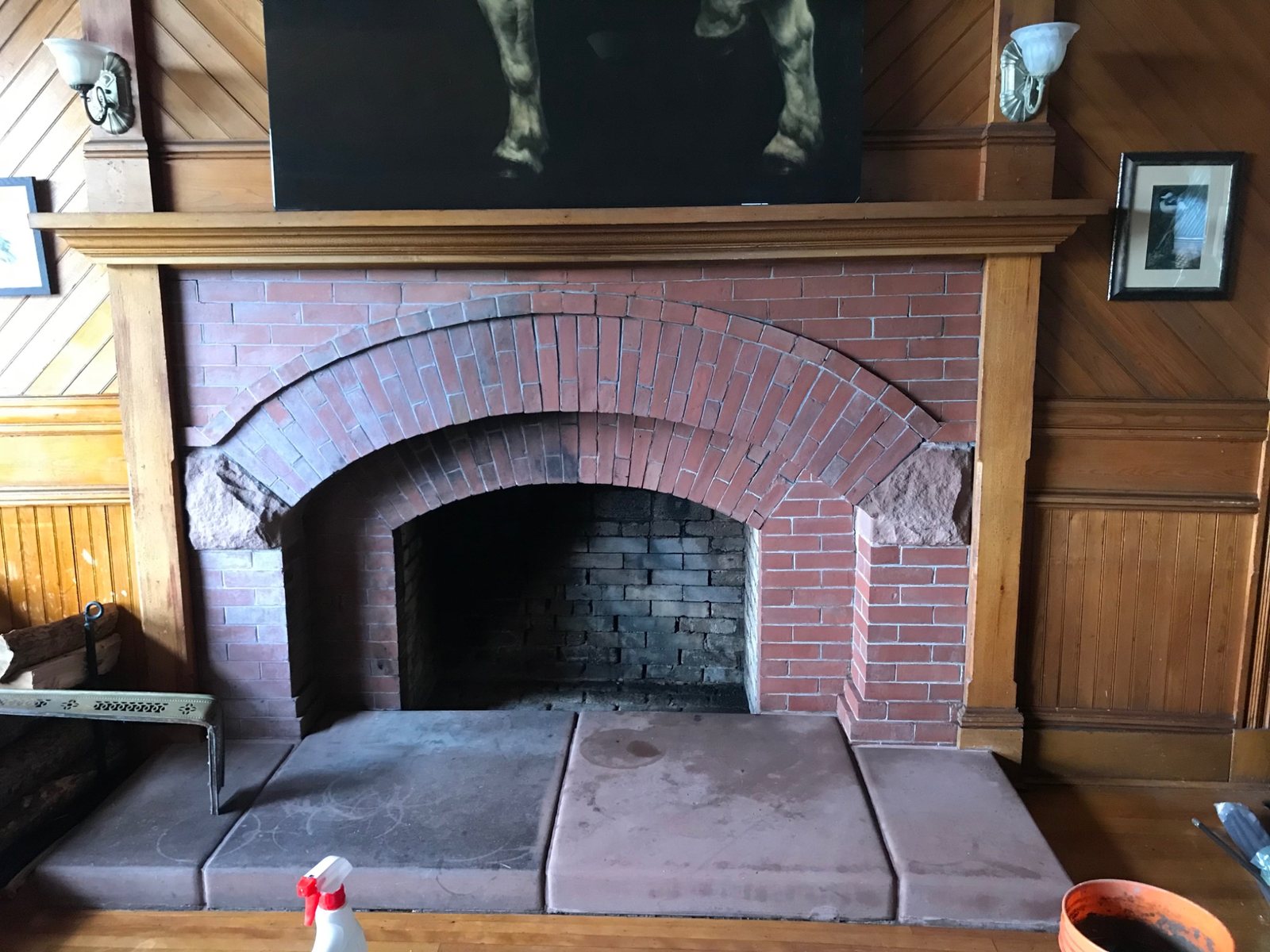 Large brick arch fireplace showing an opening where structural masonry and proportions are part of the design