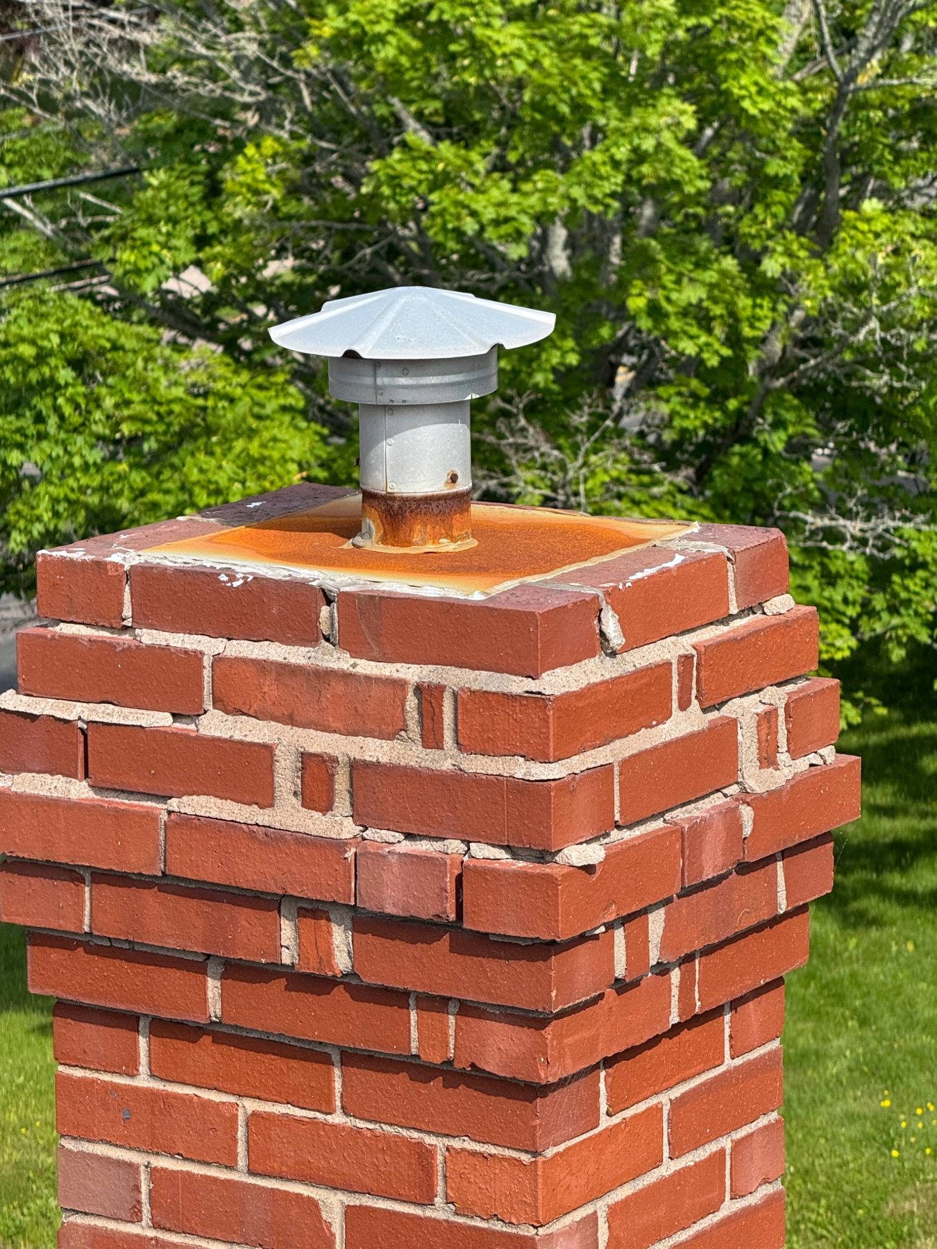 Chimney crown deterioration that can allow water into a fireplace and flue system