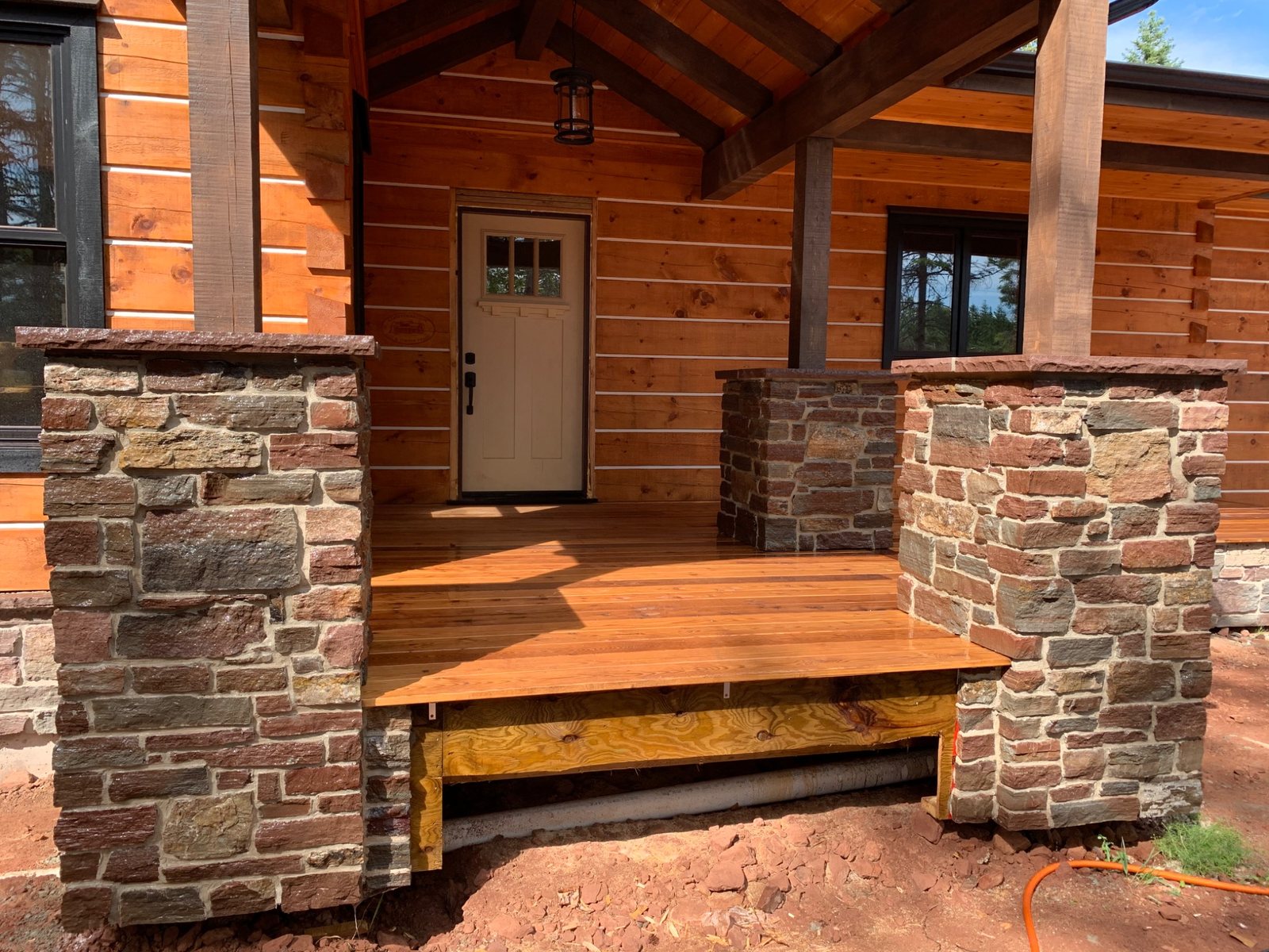 Natural stone entrance pillars and porch masonry by DinoMac Masonry in PEI